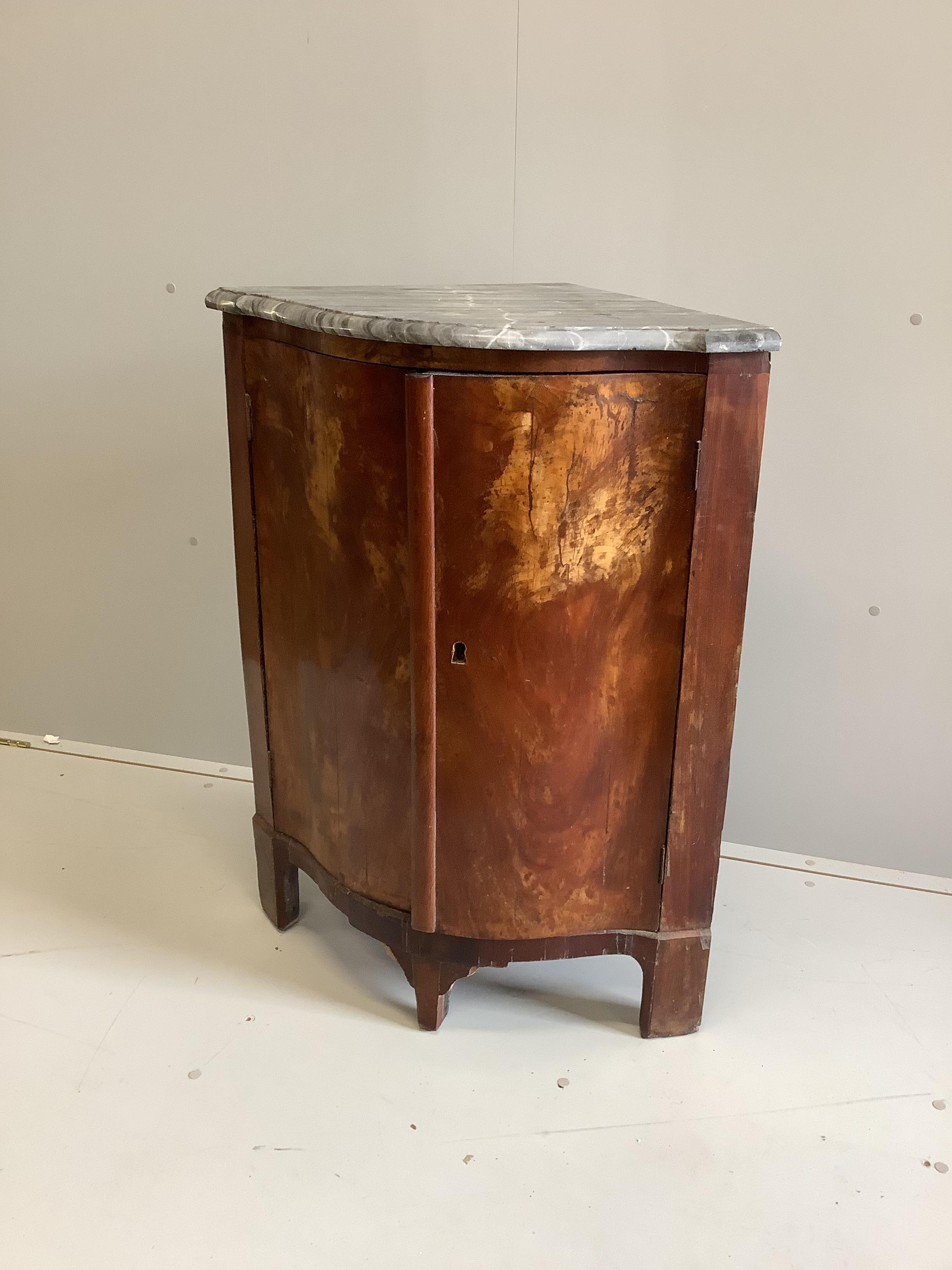 A 19th century Continental serpentine walnut marble topped corner cupboard, width 74cm, depth 52cm, height 94cm